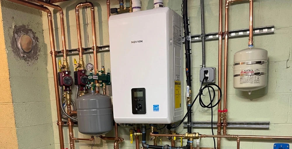 High-efficiency Navien boiler installation with copper piping and expansion tanks by Precision Comfort Heating and Air Conditioning
